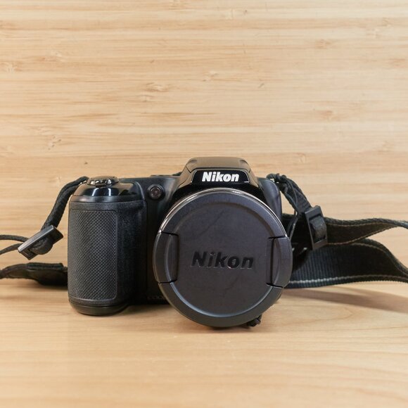 The Nikon Coolpix L330 is a vintage-style 20.2MP digital camera featuring a powe - Picture 2 of 7